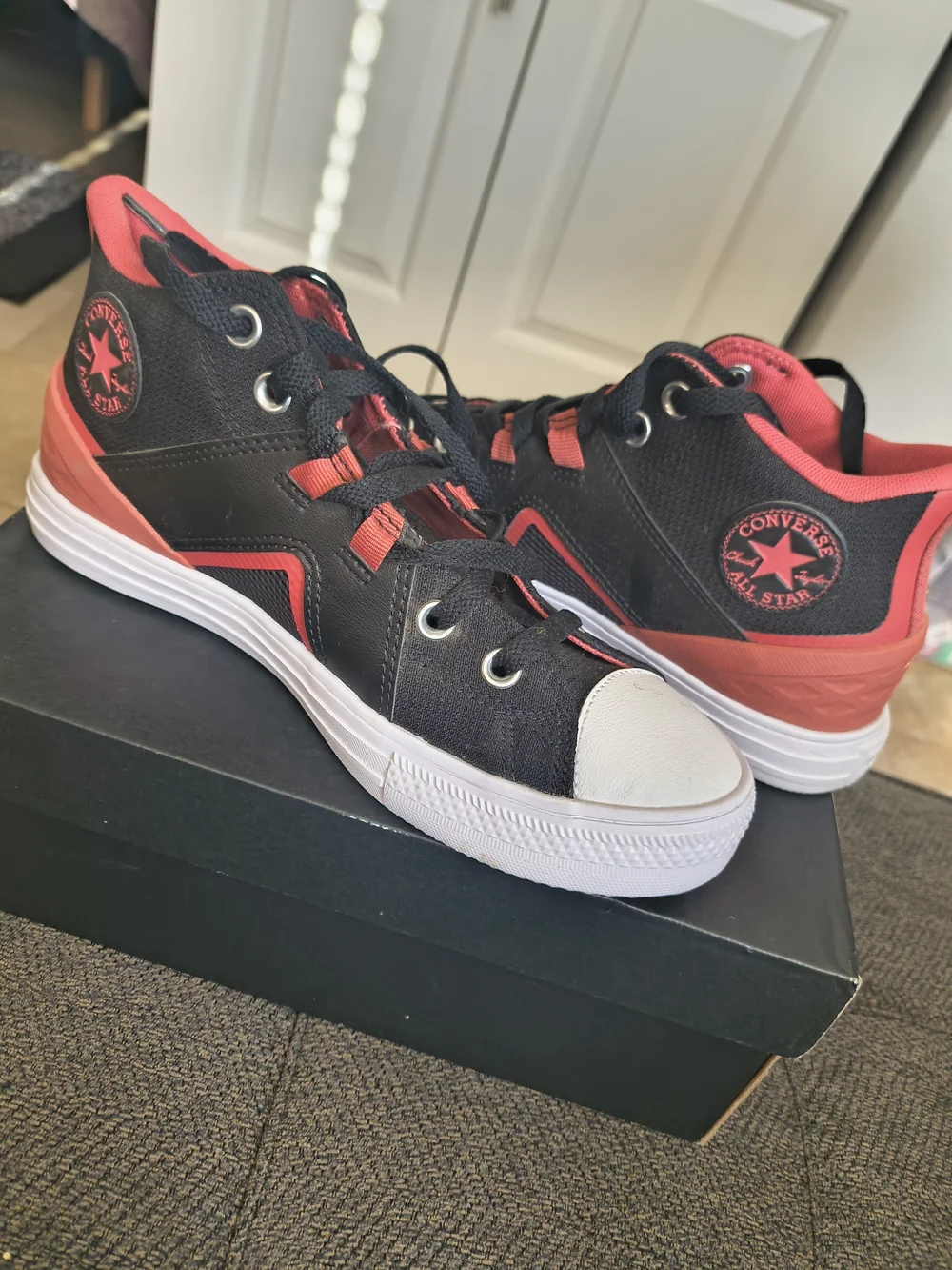 Converse Black and Red High-Top Sneakers with White Toe
